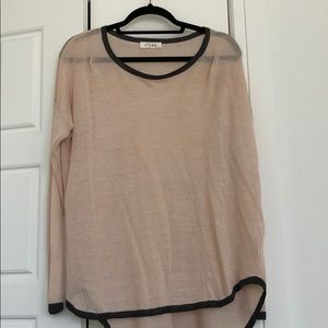 Cream sweater with dark grey trim